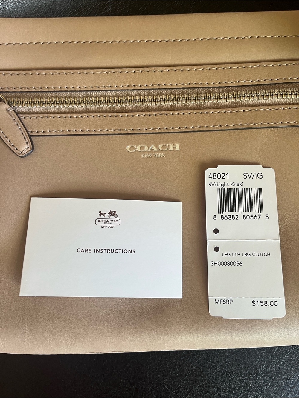 COACH Light Khaki Leather Clutch with Gold-Tone Logo